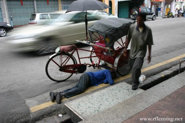 Sleeping trishaw man